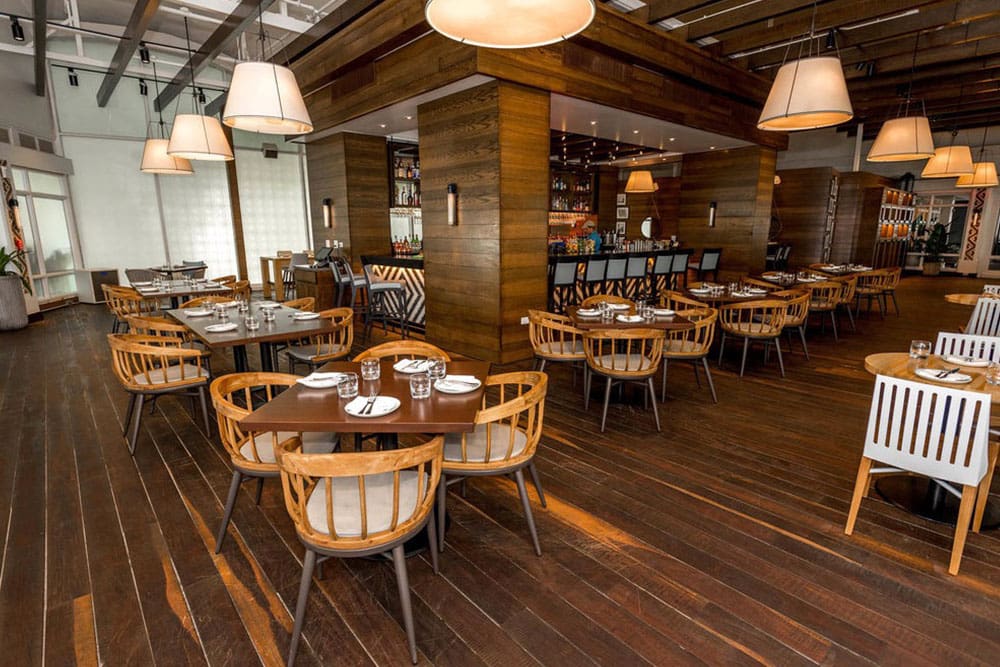 Restaurant dining room at the Hotel El San Juan with Designform wood and rope chairs