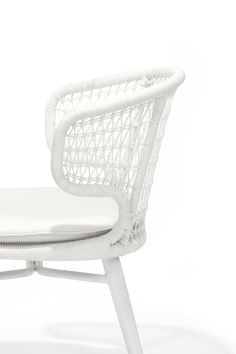 Close-up of a white woven wicker Al Fresco chair