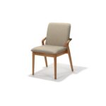 Gramercy Side Chair with upholstered seat and back and powder-coated matte black metal detail, front three-quarter view