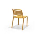 Cala Chair in Mustard, rear three quarter view – poly-molded outdoor chair