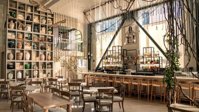 Copra restaurant bar and dining room in San Francisco with Designform Tusk stools and Smith chairs