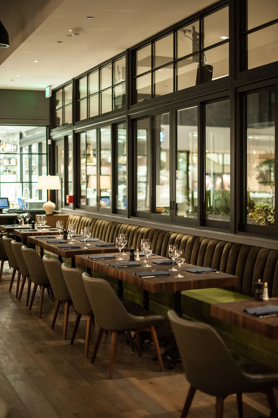 Designform Niro chairs around a round table at The Henry, Los Angeles.