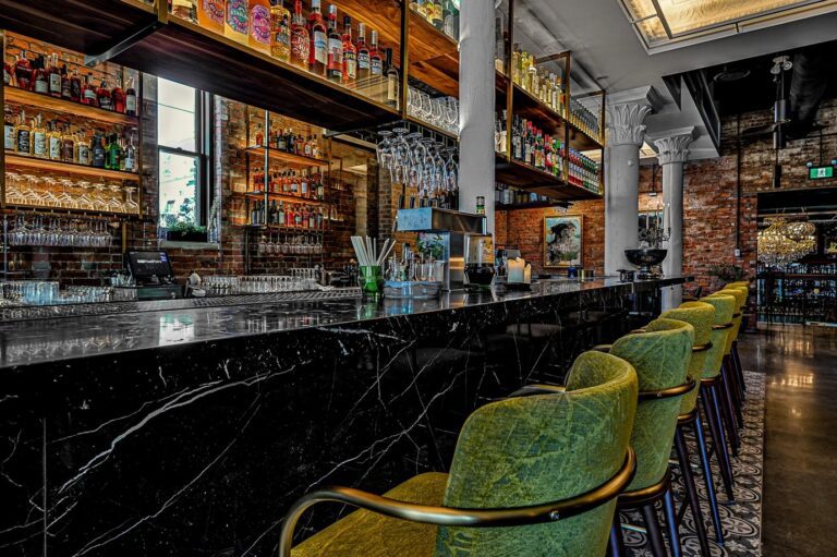 Designform Aspen stools with arms at the bar at Nero, Edmonton, AB
